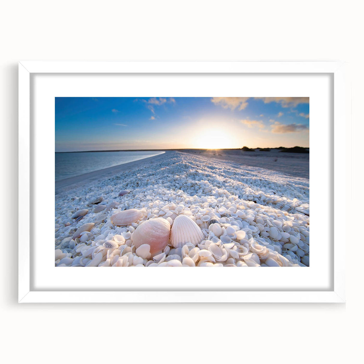 Framed wall art collection showcasing serene seascapes and landscapes, featuring a white mat and sleek frame, perfect for modern home decor.