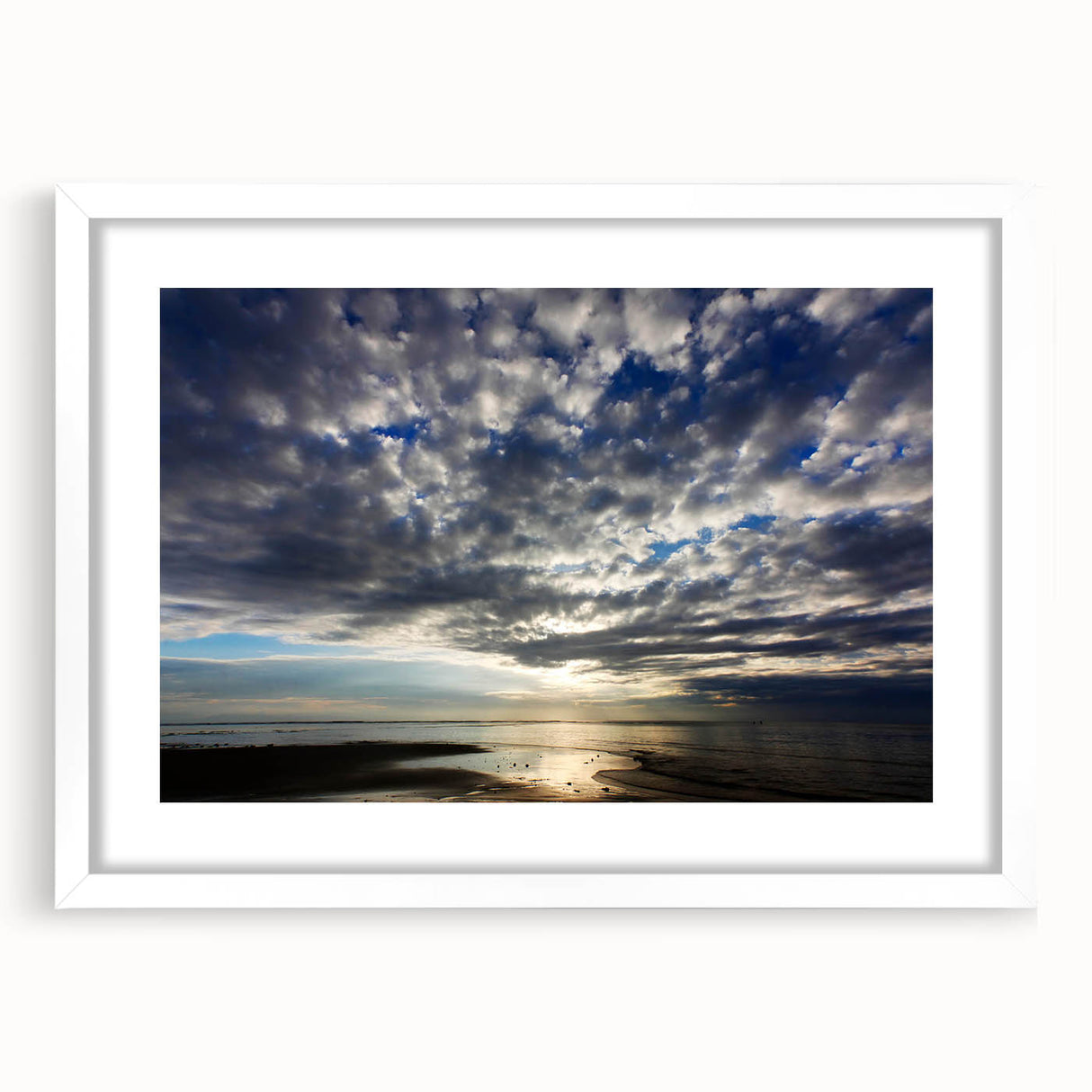 Framed wall art showcasing a serene landscape with vibrant skies and lush greenery, presented with a white mat for an elegant finish, perfect for home decor.
