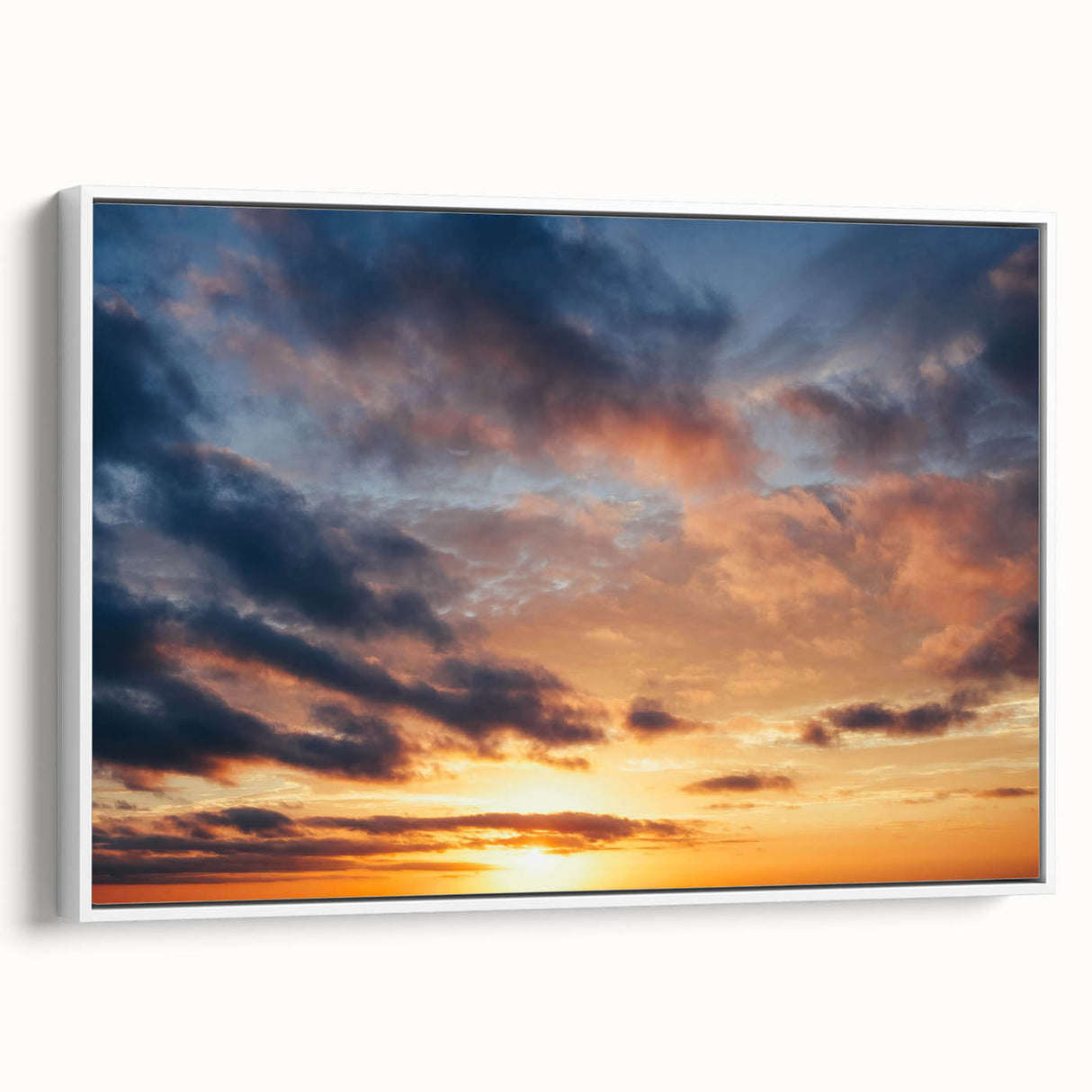 Framed canvas artwork showcasing a serene landscape with vibrant colors, accented by a white frame, ideal for modern home decor and interior design.