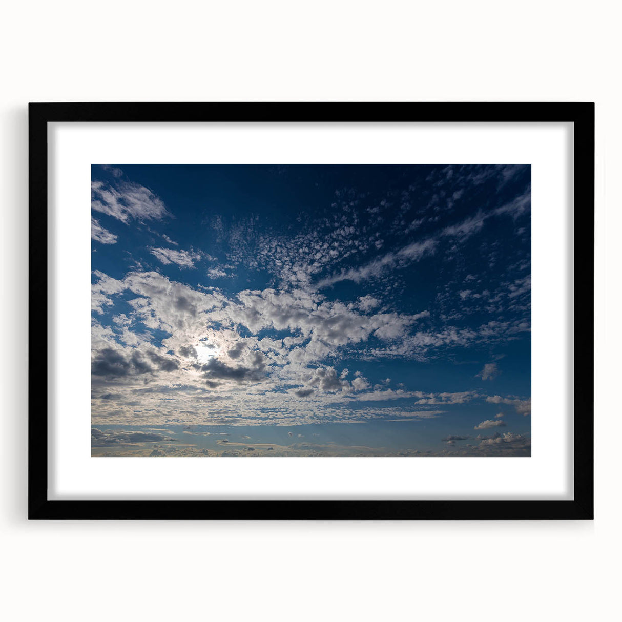 Framed wall art collection showcasing a serene landscape with skyscapes, featuring a sleek black frame and mat, perfect for modern home decor.