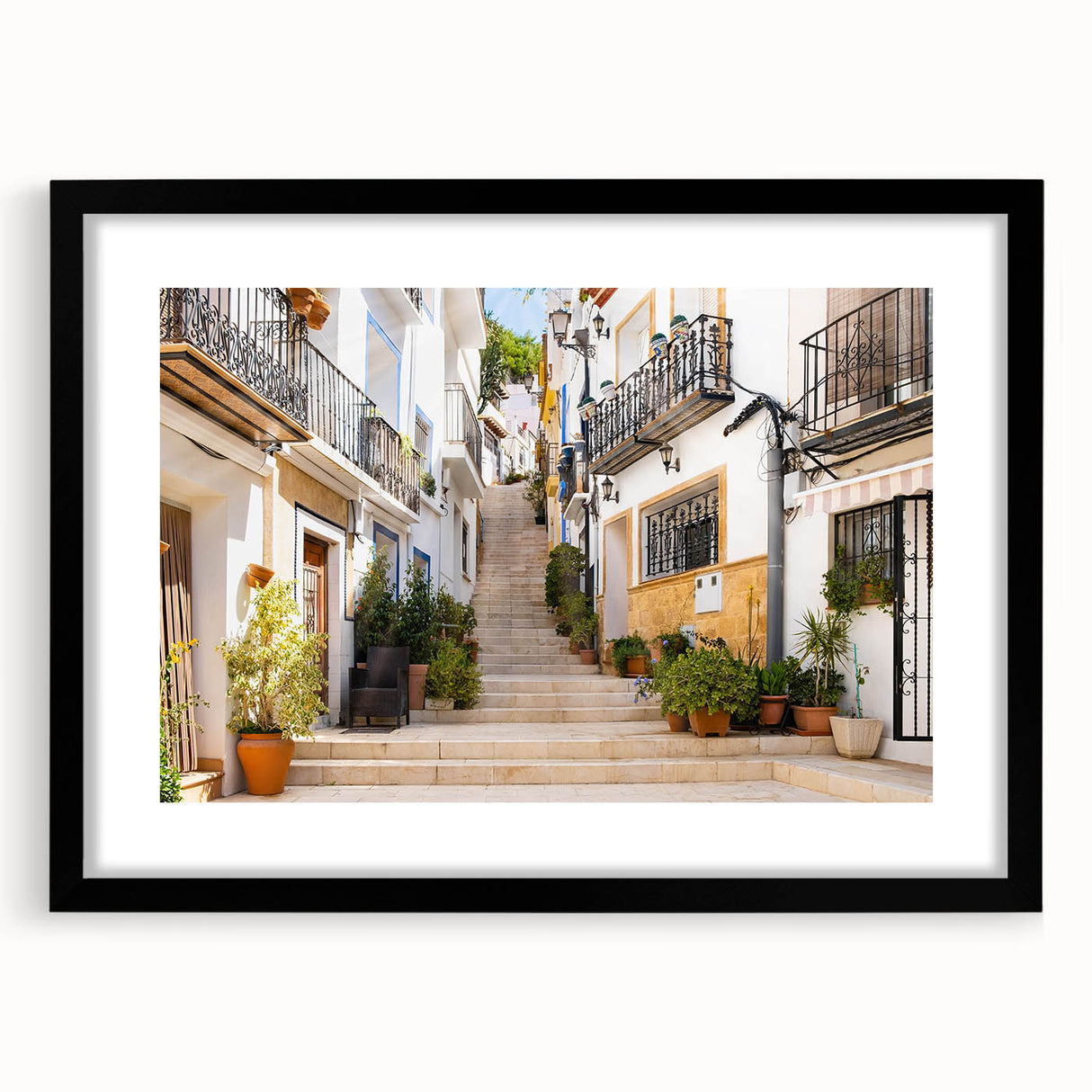 Black-framed wall art featuring a vibrant landscape street design, elegantly matted, perfect for home decor or office settings, enhancing modern aesthetics.