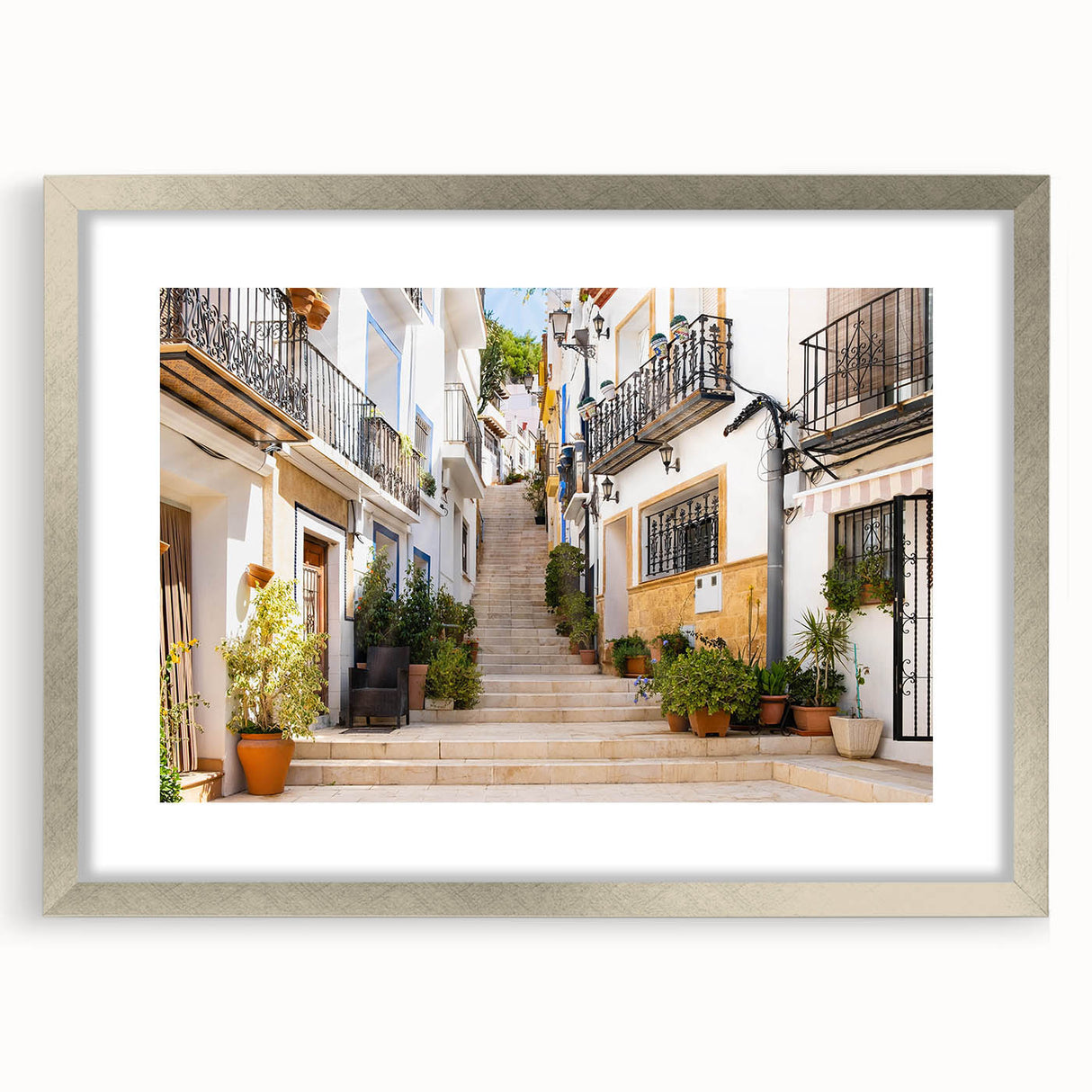 Framed wall art from the Landscapes Streets Design collection, showcasing a silver mat and intricate detailing, ideal for enhancing modern home decor.