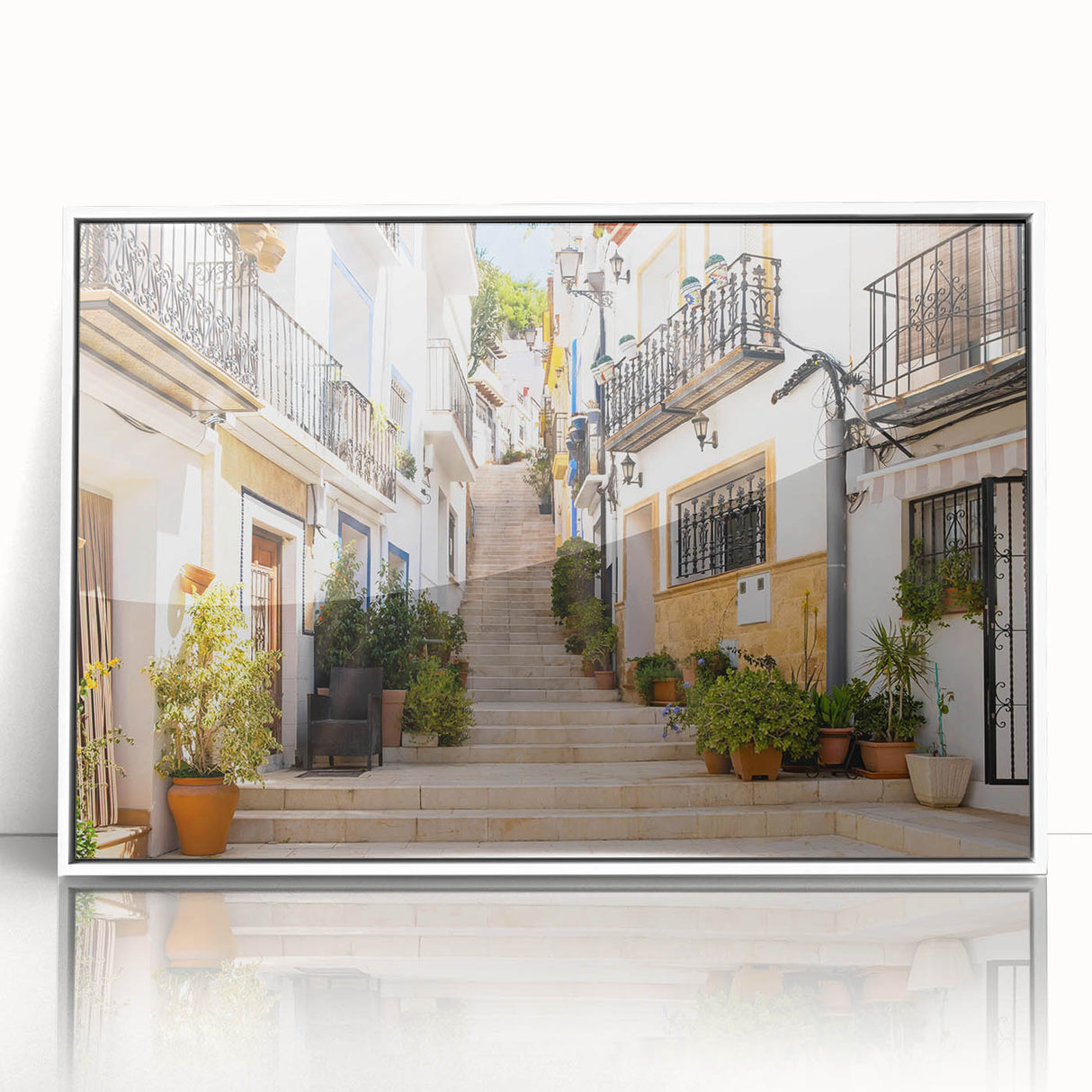 Framed wall art featuring a vibrant landscape design with colorful streets in a modern aesthetic; displayed in a sleek white frame, ideal for contemporary decor.