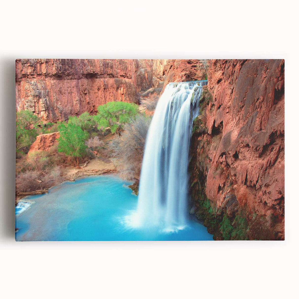 Stretched canvas artwork showcasing a vibrant waterfall landscape, featuring lush greenery and cascading water, ideal for home decor and nature lovers.