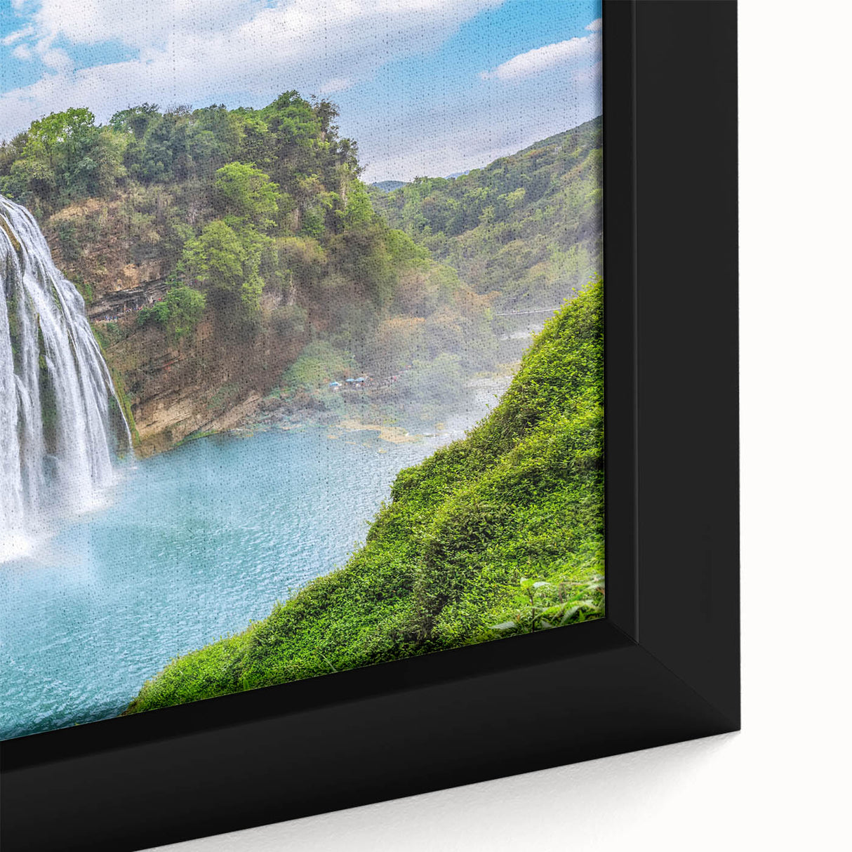 Framed canvas wall art showcasing a vibrant landscape waterfall scene, featuring rich blues and greens, ideal for home decor. Perfect for nature lovers and art enthusiasts.