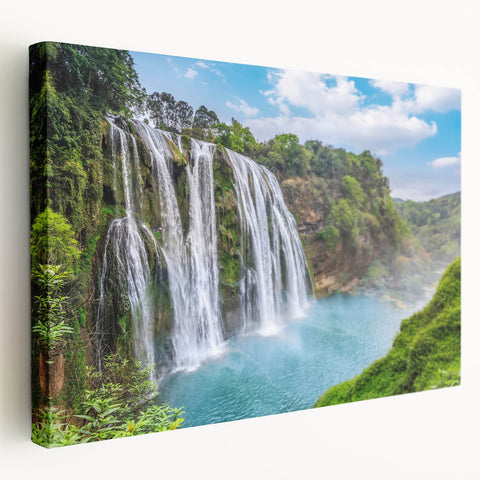 Stretched canvas wall art showcasing a serene waterfall landscape, featuring vibrant blues and greens, perfect for home decor. Ideal for nature enthusiasts seeking tranquility.