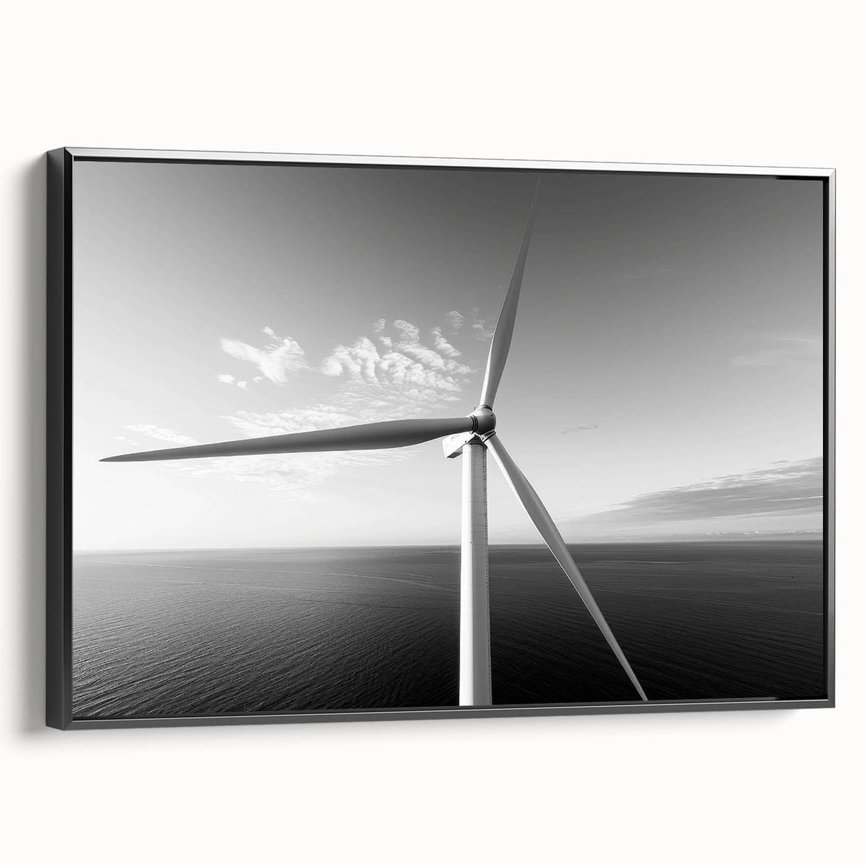 Framed canvas wall art showcasing a serene landscape with windmills, set against a vibrant sunset, featuring a sleek black frame for modern decor enhancement.