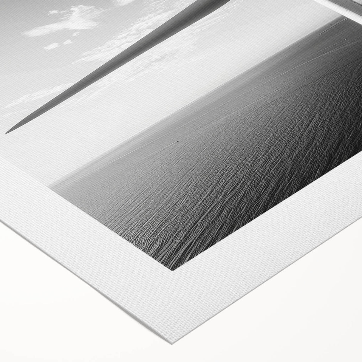 Rolled canvas artwork depicting a serene landscape with windmills, showcasing vibrant colors and intricate details, ideal for home or office decor.