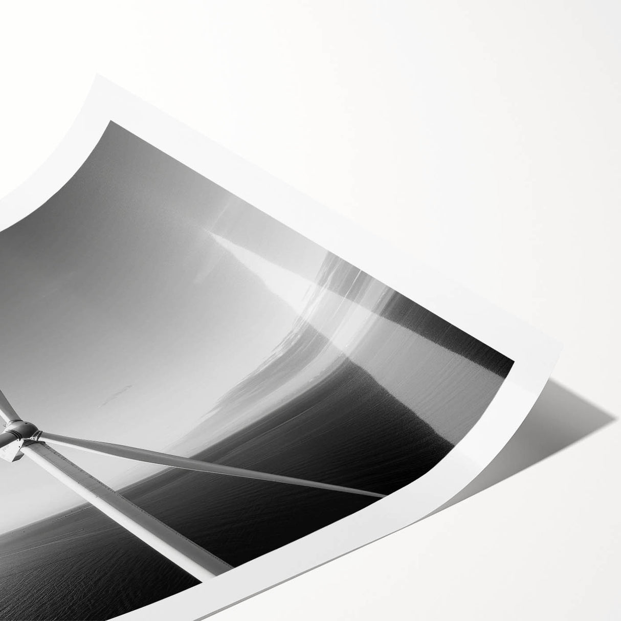 Colorful wall art print showcasing a serene landscape with windmills against a vibrant sunset, rolled up for easy transport and display in home decor.