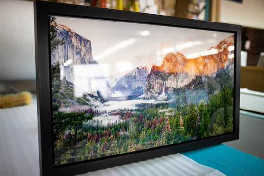Framed metal landscape print close-up