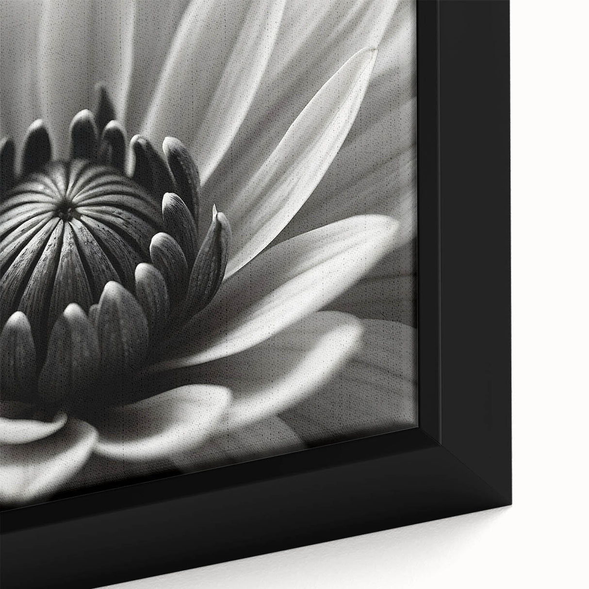 Close-up of a black framed canvas featuring a textured floral design in vibrant colors, ideal for living room decor.