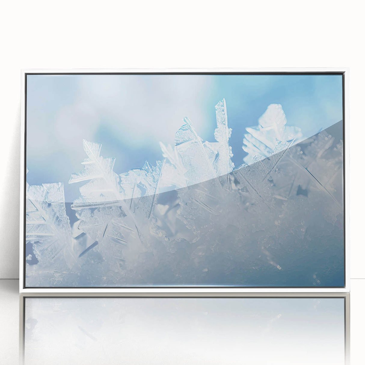 Close-up of frost patterns on ice in a white framed acrylic print, suitable for modern art wall decor.