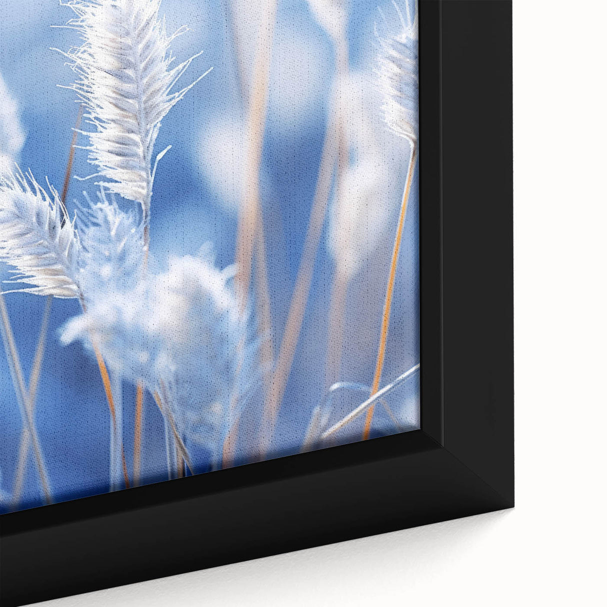 Close-up of black wall art featuring a frost-like textured design in vibrant colors on a framed canvas.