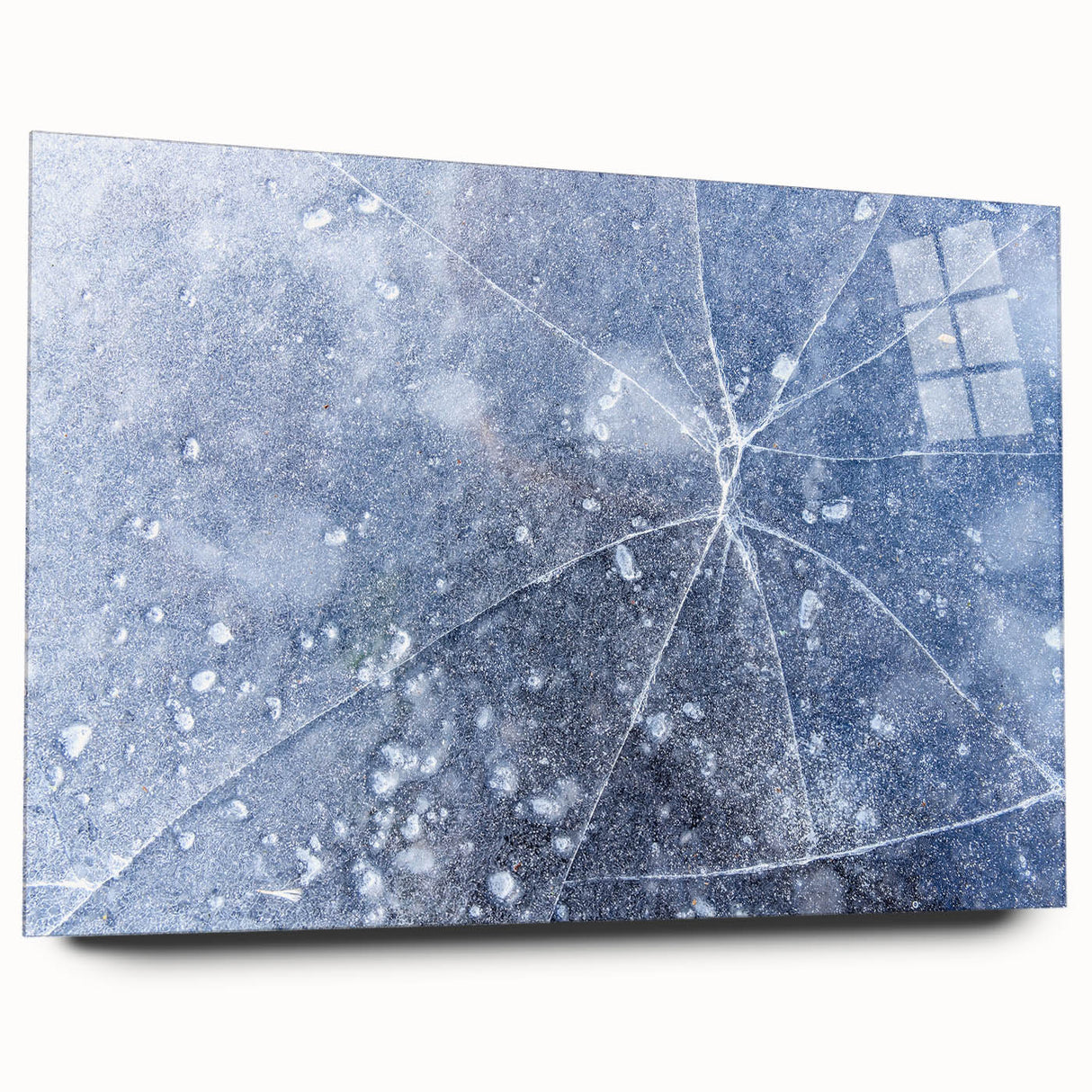 Close-up of frost patterns in muted blue and white tones on an acrylic glass.