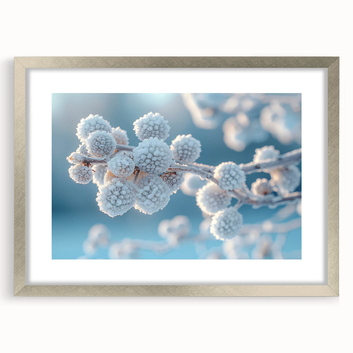 Abstract art print of frost patterns in muted gray, framed in silver, suitable for bedroom or dining room decor.