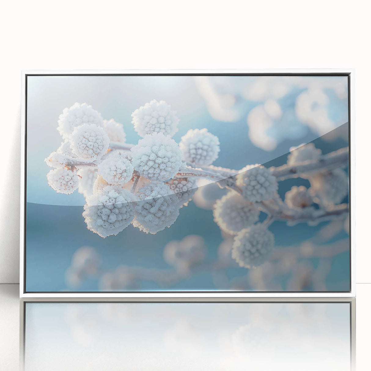 Framed acrylic print featuring a close-up of frost patterns in muted white and gray tones, ideal for modern art wall decor.