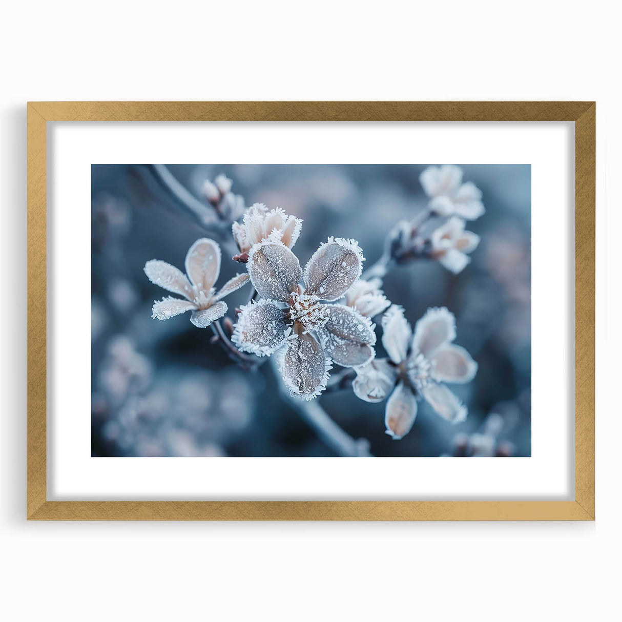 Textured art of abstract frost design in gold frame with mat, featuring muted blue and white tones, ideal for bedroom art.