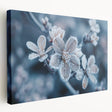 Close-up image of frost patterns on ice in muted blue and white tones, printed on stretched canvas.