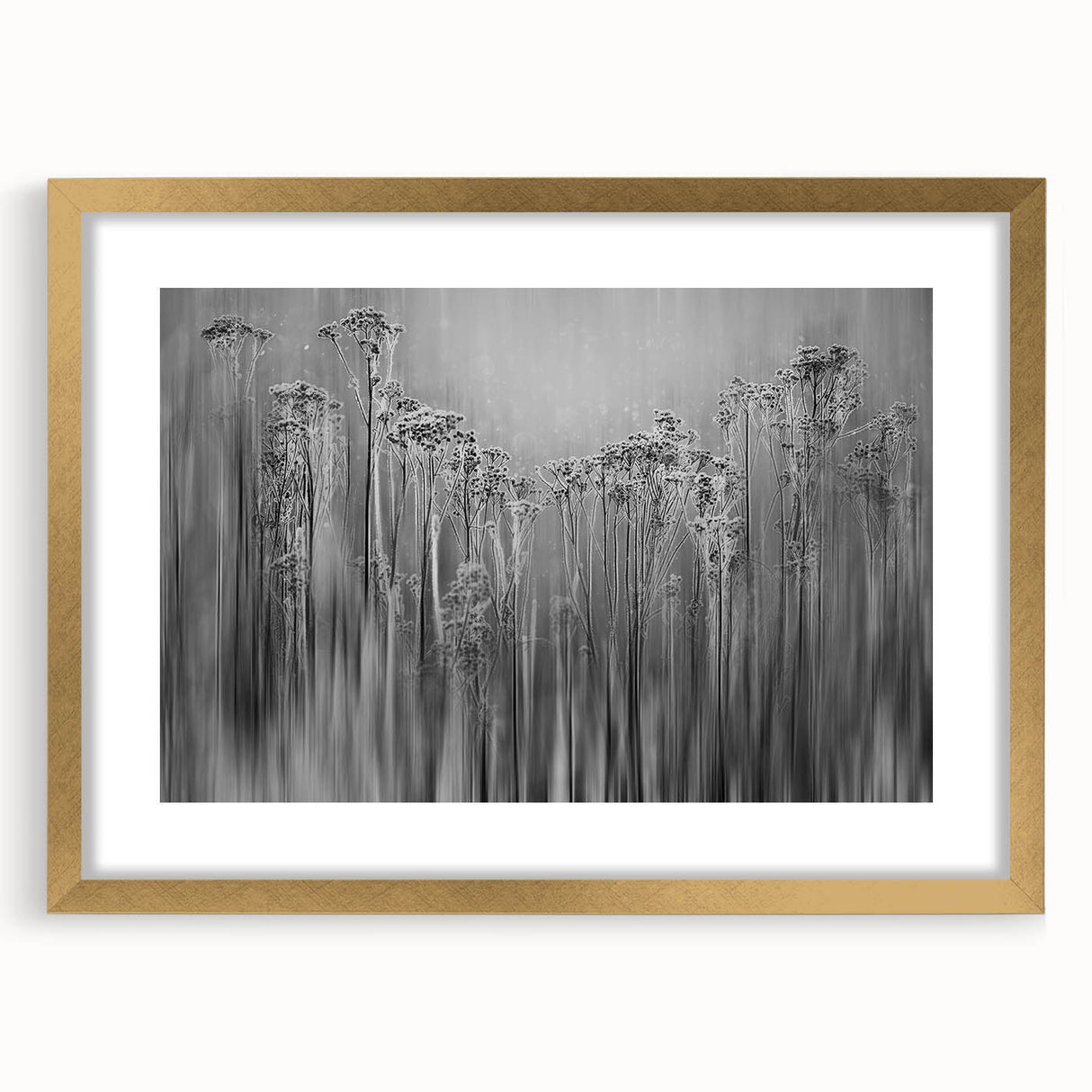 Textured art depicting abstract frost patterns in icy blue tones, framed in gold, ideal for modern bedroom decor.