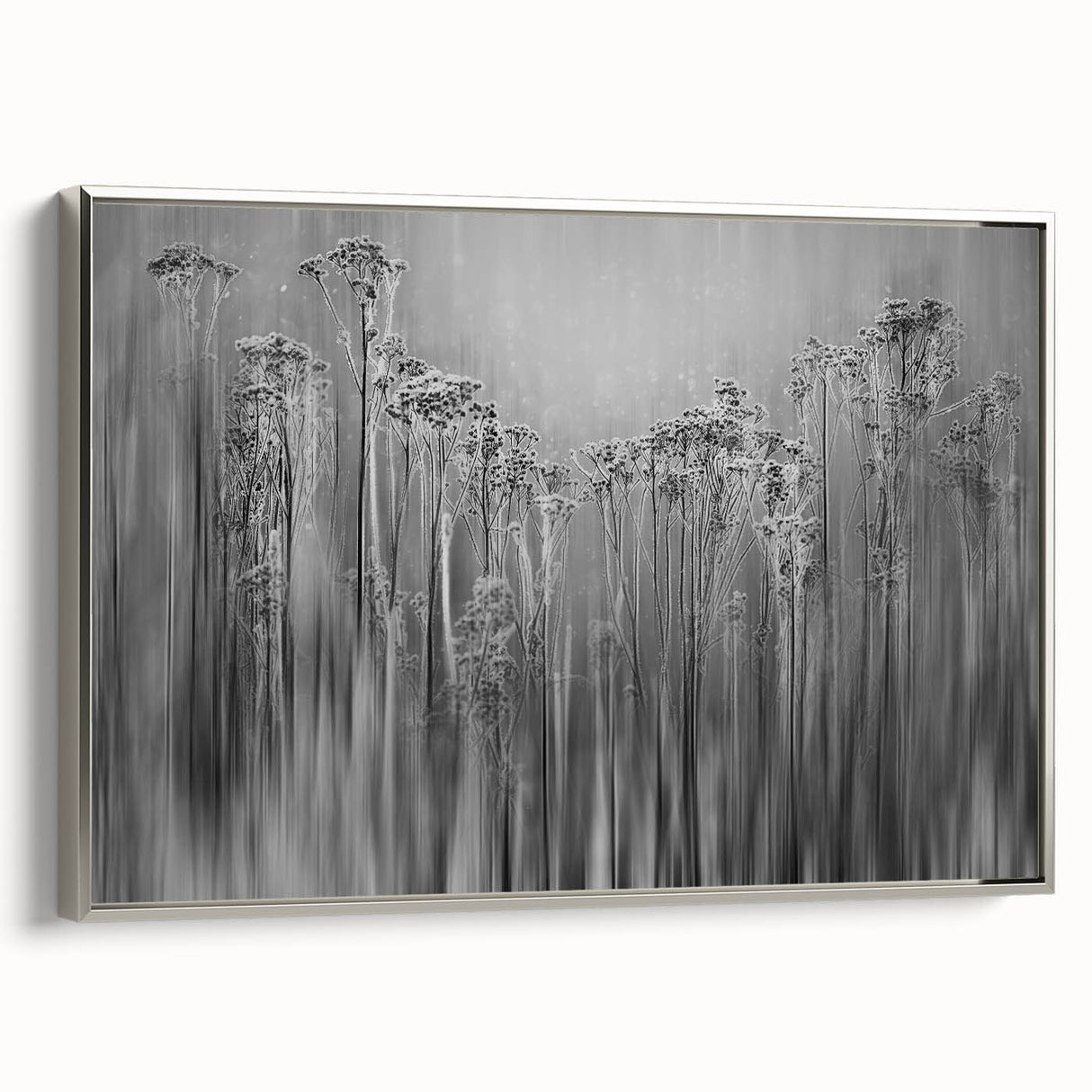Vintage poster art of frost patterns in muted gray and silver on a framed canvas, suitable for living room decor.