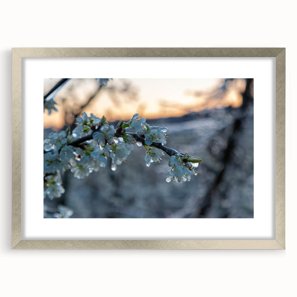 Abstract art print of a frost design in silver frame, featuring cool blue and white tones, ideal for dining room decor.