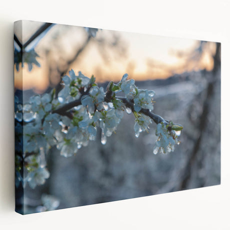 Close-up image of frost patterns on ice, rendered in cool blue and white tones on a stretched canvas.