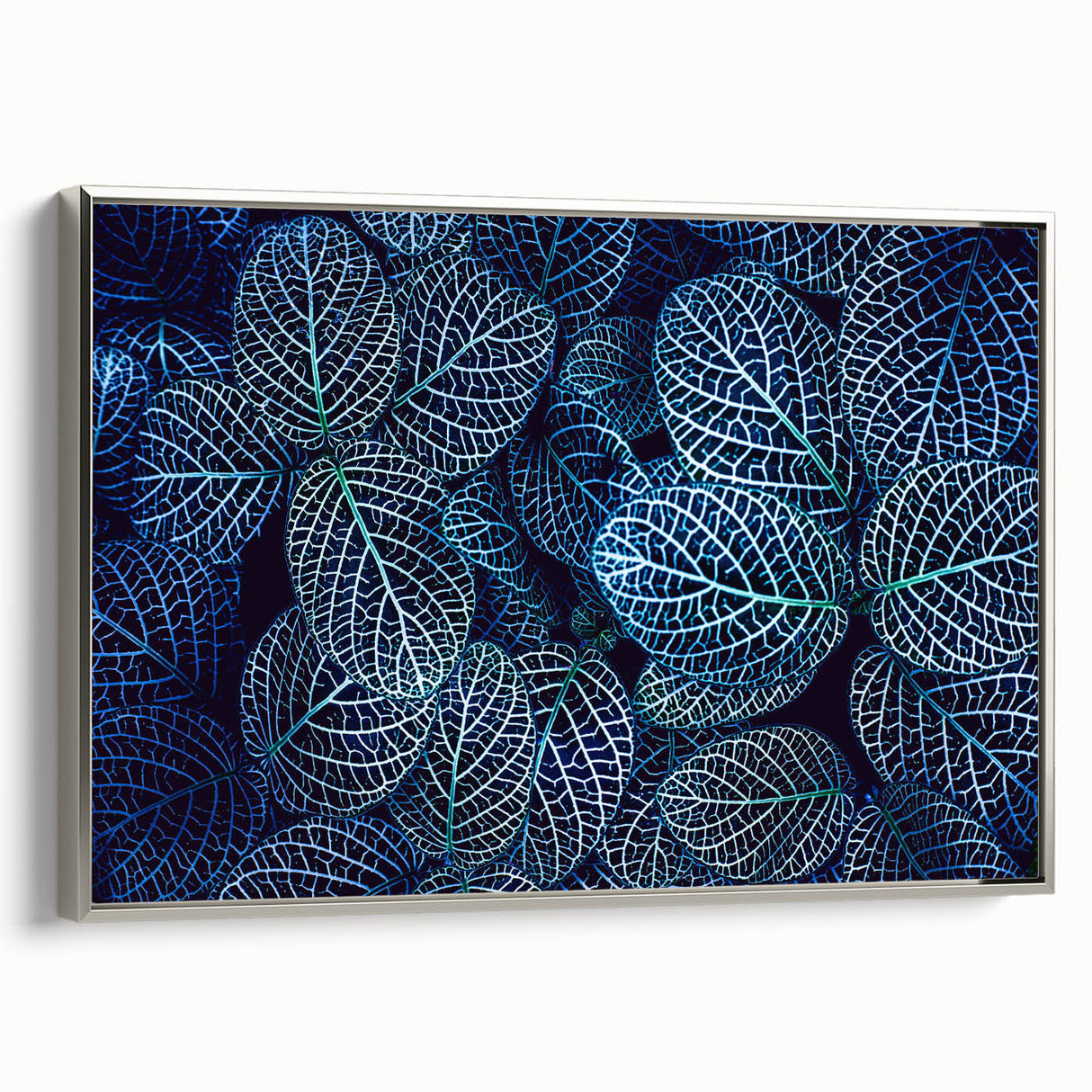 Framed canvas depicting a close-up of leaves in muted green and black tones, ideal for enhancing a vintage-styled study room.