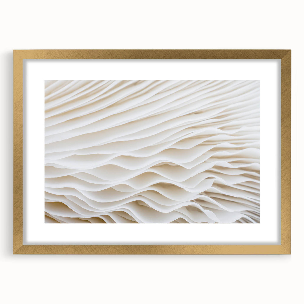 Extra large abstract art print featuring textured leaf designs in gold and green, framed with mat.