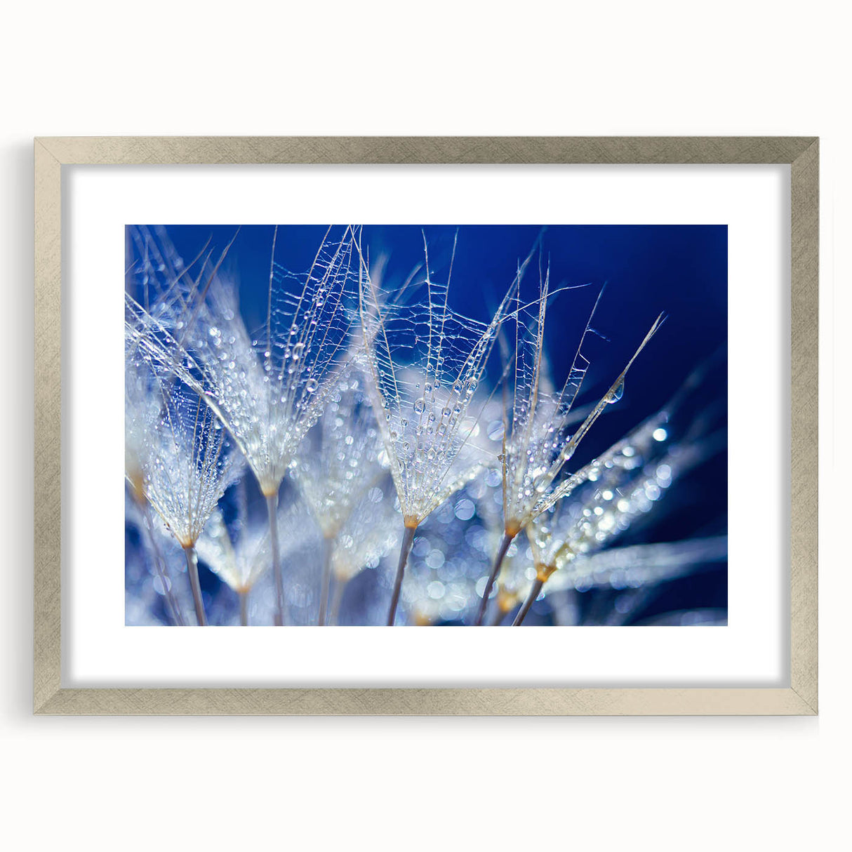 Textured art print featuring close-up abstract water design in silver frame, ideal for modern bedroom ambiance.
