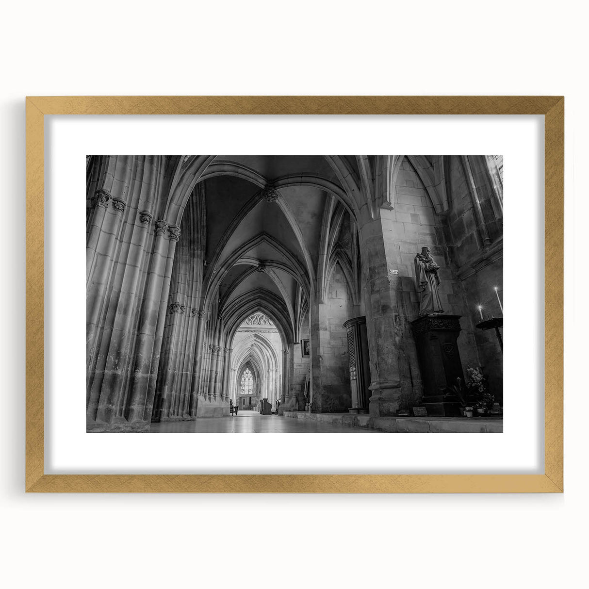 Textured abstract art print of a church design in muted gold and white tones on a framed canvas, suitable for bedroom decor.