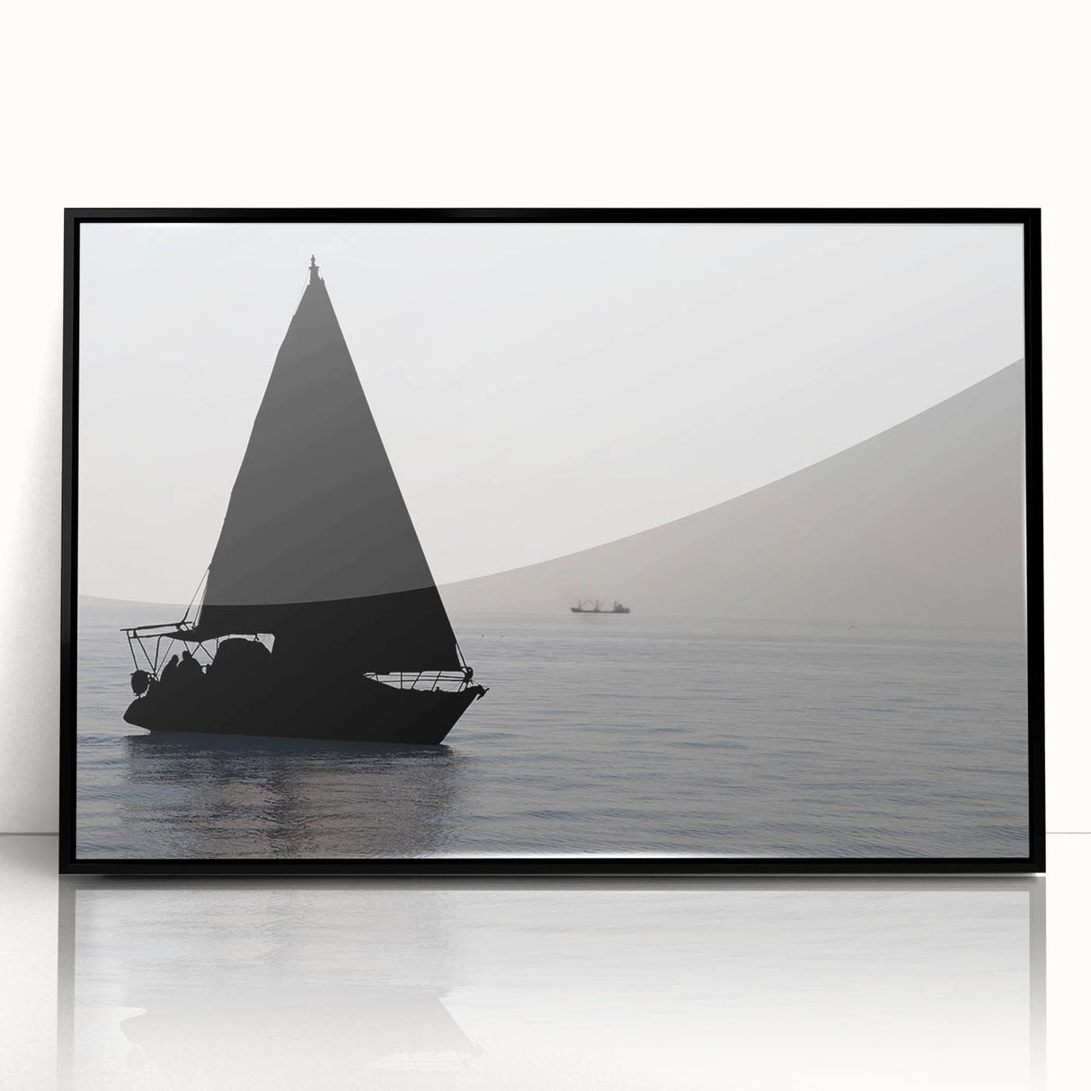 Large abstract wall art of a sailboat, in muted blue and white tones on a black framed acrylic.