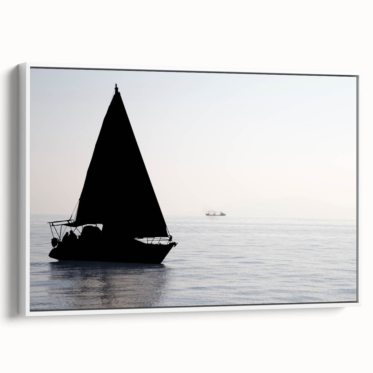 Framed canvas depicting a vintage-style sailboat on a muted black and gray sea, ideal for bedroom wall art.
