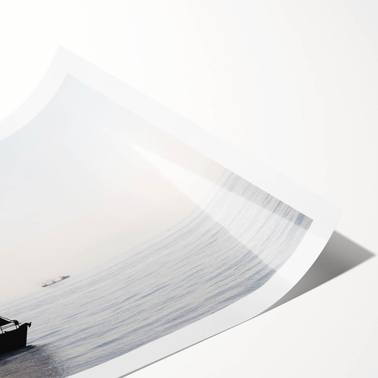 Extra large wall art featuring a sailboat with vibrant blue and white tones on a rolled print.