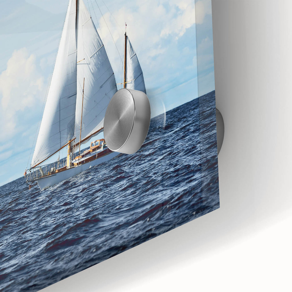 Large abstract sailboat print in muted blues and grays on acrylic glass.