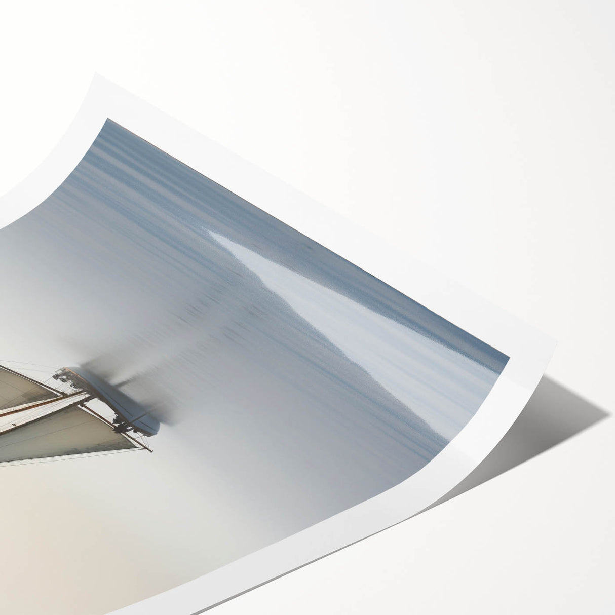 Extra large wall art depicting a sailboat on calm waters, rendered in soft blue and white tones on a rolled canvas.