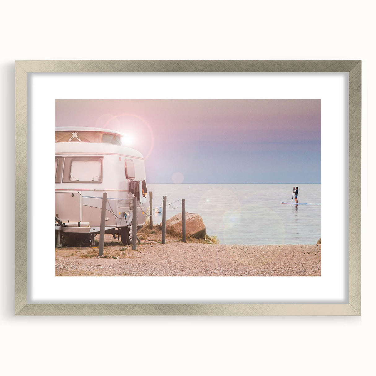 Abstract art print featuring a caravan in muted earth tones on a framed silver mat, ideal for dining room decor.