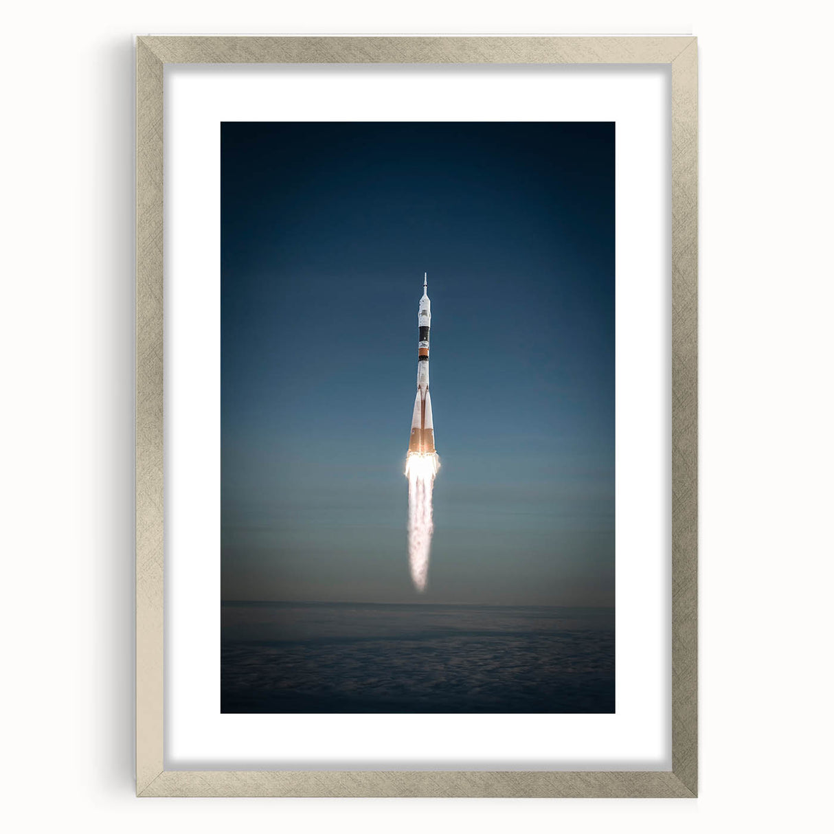 Abstract art print of a spacecraft in muted metallic tones on a silver-framed mat, ideal for dining room decor.