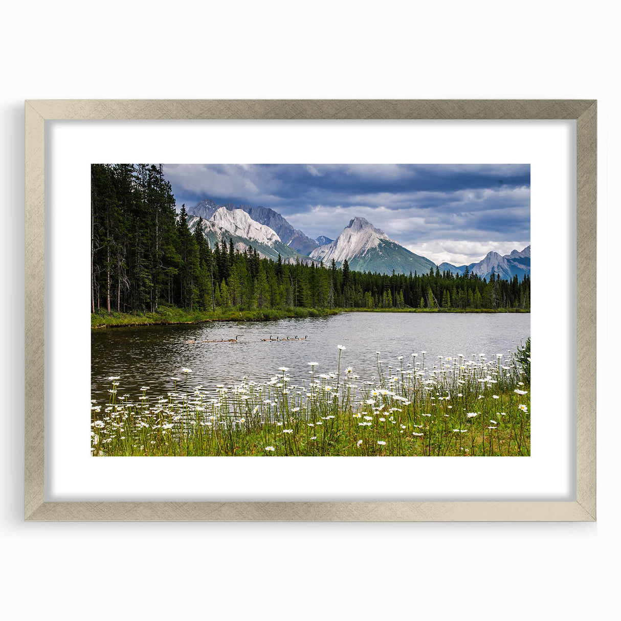 Framed wall art featuring a vibrant wildflower design with a silver mat, ideal for home decor. Showcases colorful blossoms against a neutral backdrop, enhancing any interior space.