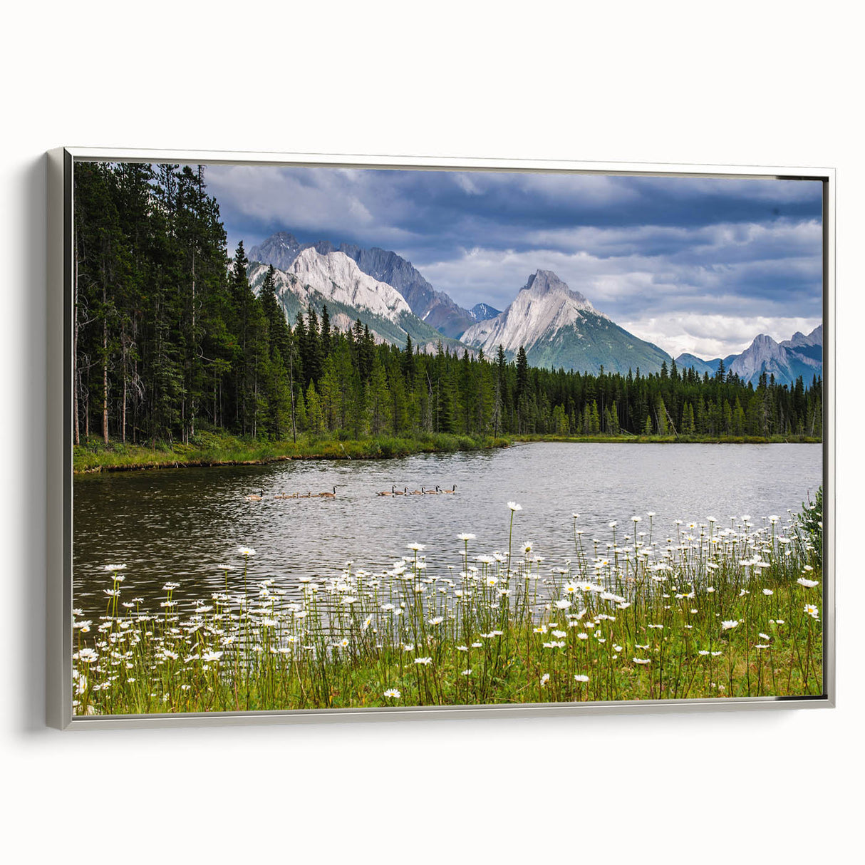 Framed canvas wall art showcasing a vibrant wildflower design with silver accents, displayed in a modern setting, perfect for home decor enthusiasts.