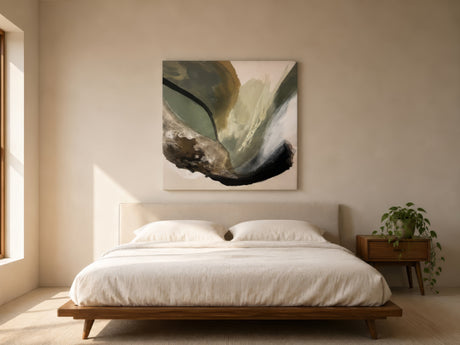 Neutral abstract painting with green, beige and black brushstrokes above upholstered headboard in calm minimalist bedroom