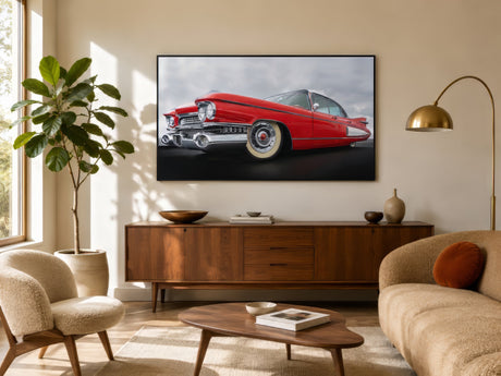 Red 1950s Cadillac classic car print with chrome detailing, framed above a walnut sideboard in a warm modern living room.