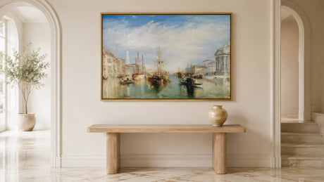Impressionist Venice Grand Canal painting in coastal blue and ochre, gold-framed above a wood console in a sunlit Mediterranean living room.