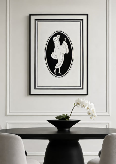 Black and white Art Deco draped figure print in oval composition, framed above a black dining table in an elegant neutral room.