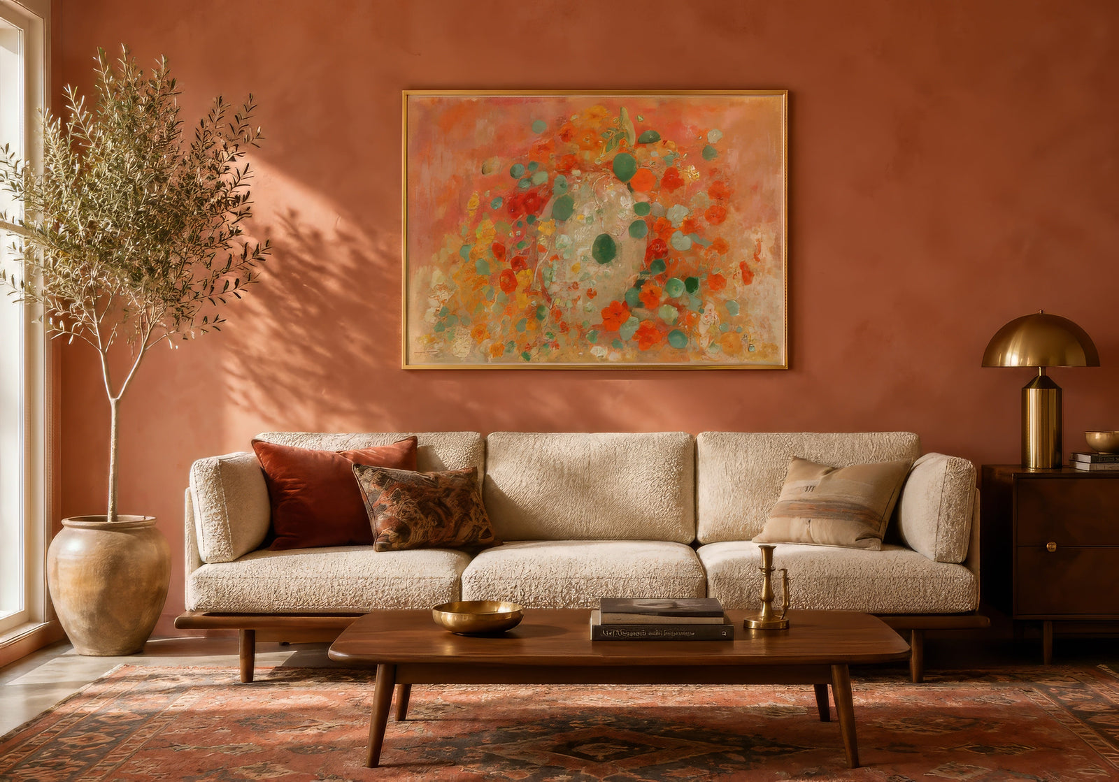 Vintage-style abstract floral print in coral, orange, and teal over a cream sofa in a warm terracotta modern living room.