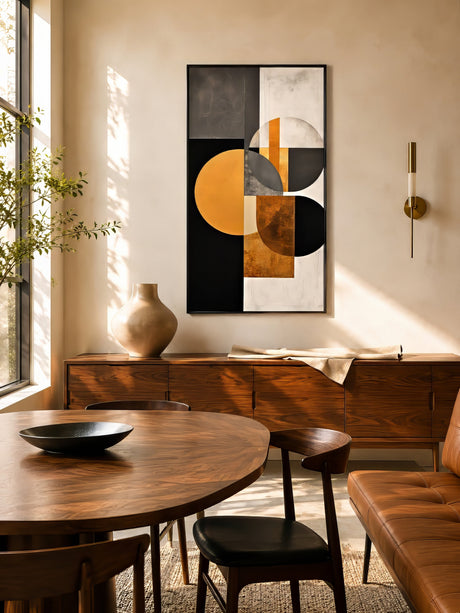 Large horizontal black, gold, and gray geometric abstract canvas above a walnut table in a warm mid-century dining room.