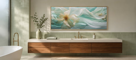 Soft blue and white floral magnolia canvas in wood frame above a wood vanity, spa bathroom with cream towels.