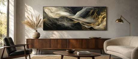 Panoramic gestural abstract canvas in black, ivory, and gold above a walnut console in a calm neutral living room.