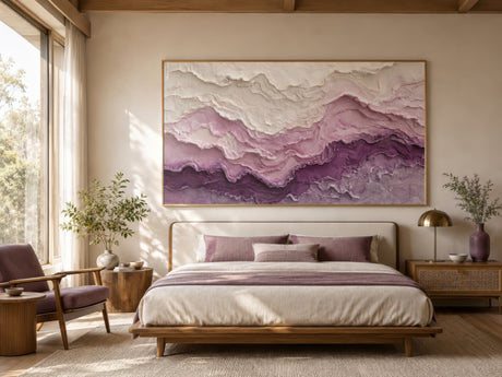 Purple and ivory textured abstract landscape canvas in a wood frame above a linen bed with wood nightstands, warm calm bedroom mood.