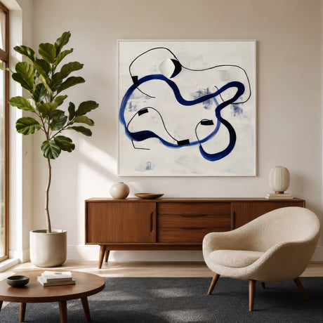 Single line body art in navy and black on ivory, framed white above a walnut console in a calm minimalist living room.