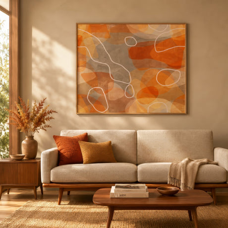 Terracotta and ochre abstract organic canvas in wood frame above oatmeal sofa in cozy minimalist living room